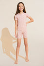 Model wears Kids Printed TENCEL™ Modal Unisex Short PJ Set in Double Diamond Rouge Pink/Rouge.