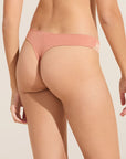 Model wears Flora TENCEL™ Modal Thong in Pink Rouge/Rose.