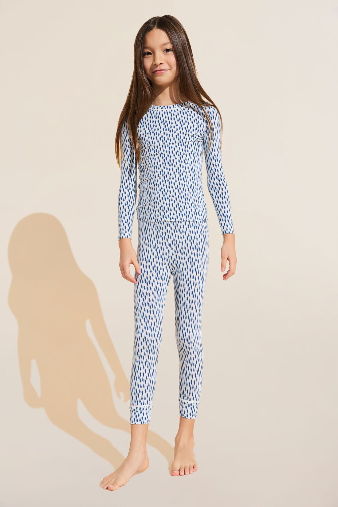 Model wears Kids Printed TENCEL™ Modal Unisex Long PJ Set in Double Diamond Denim Blue/Ivory.