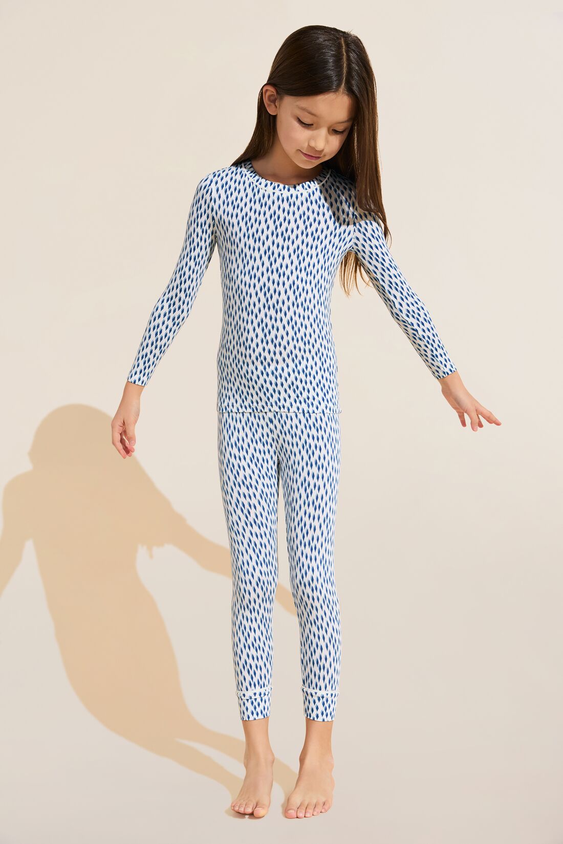 Model wears Kids Printed TENCEL™ Modal Unisex Long PJ Set in Double Diamond Denim Blue/Ivory.