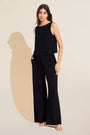 Model wears Organic Linen Knit High Waisted Pant in Black.