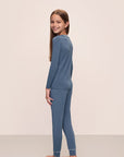 Model wears Kids TENCEL™ Modal Unisex Long PJ Set in Coastal Blue/Ice Blue.