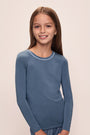 Model wears Kids TENCEL™ Modal Unisex Long PJ Set in Coastal Blue/Ice Blue.