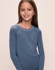 Model wears Kids TENCEL™ Modal Unisex Long PJ Set in Coastal Blue/Ice Blue.