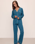 Model wears the Gisele Printed TENCEL™ Modal Long PJ Set in Festive Lights Sapphire/Ivory.