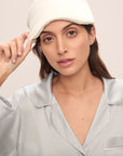 Model wears Inez Washable Silk Eye Mask in Ivory.