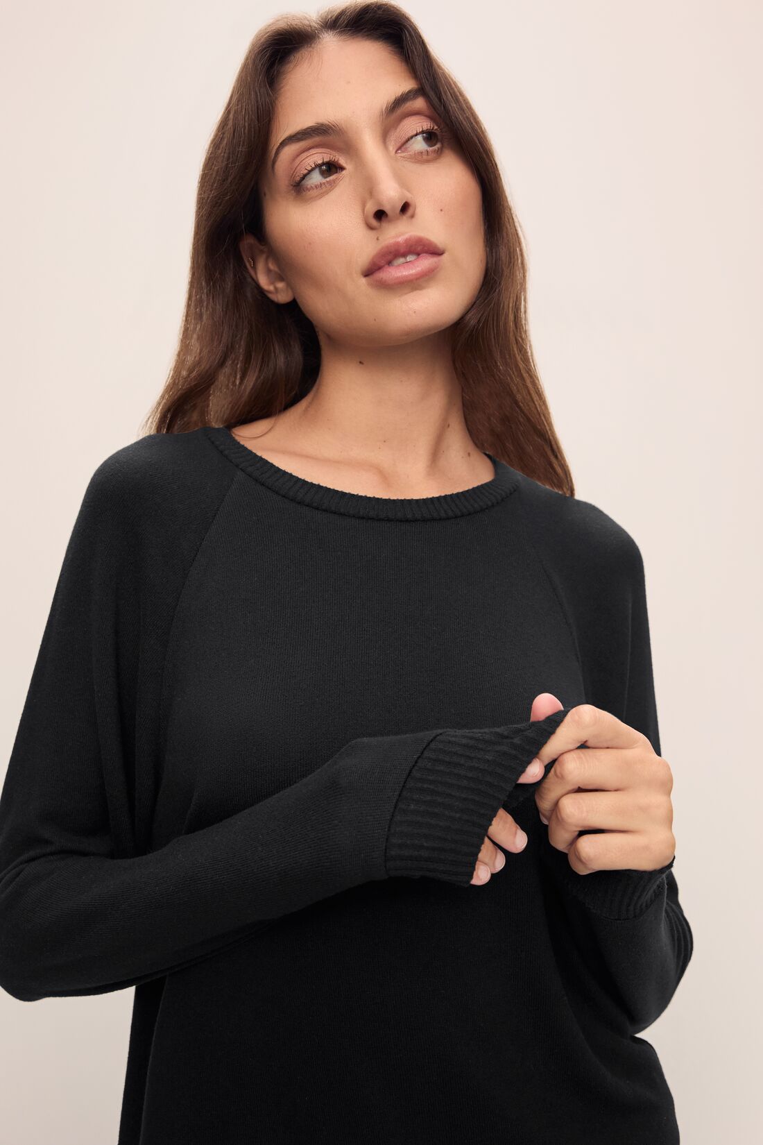 Model wears Cozy Time Crew Neck Pullover in Black.