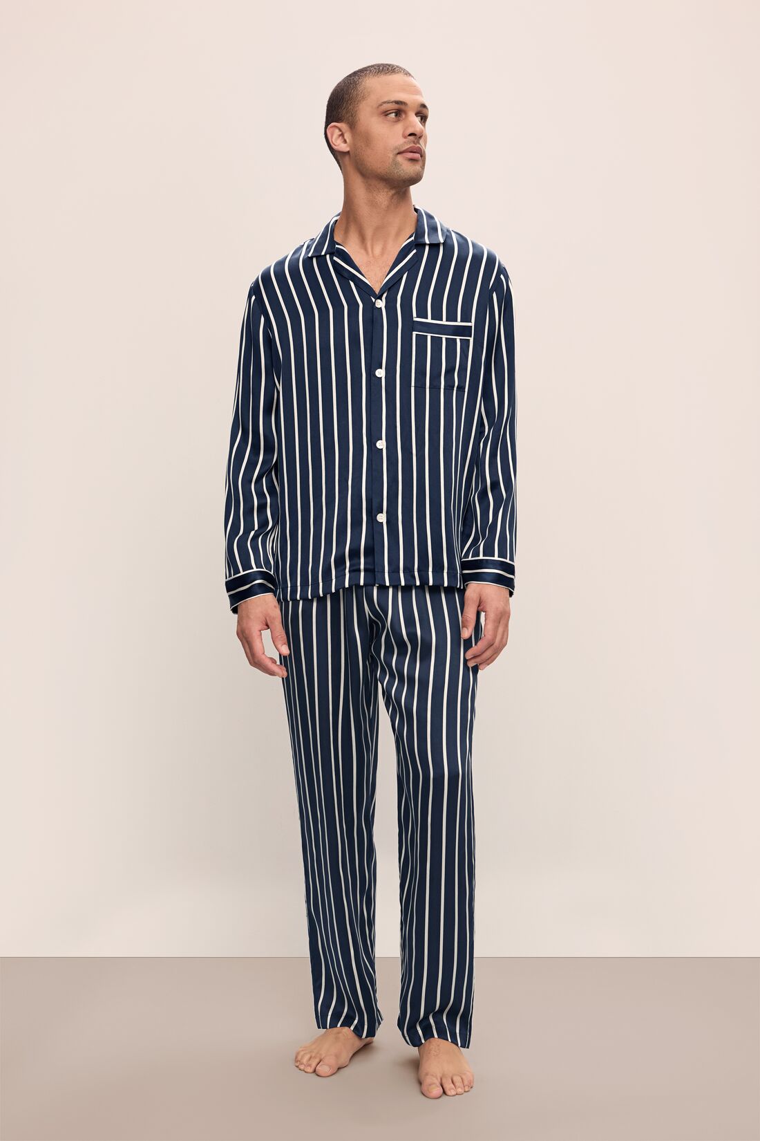 Model wears Charles Washable Silk Printed Long PJ Set in Classic Stripe Navy/Ivory.