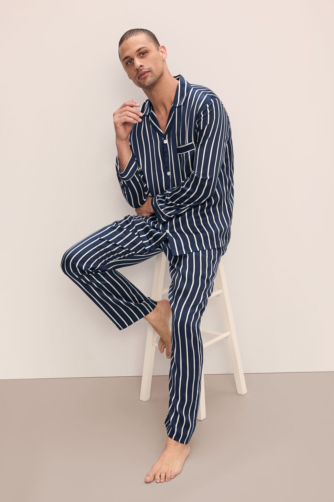 Model wears Charles Washable Silk Printed Long PJ Set in Classic Stripe Navy/Ivory.