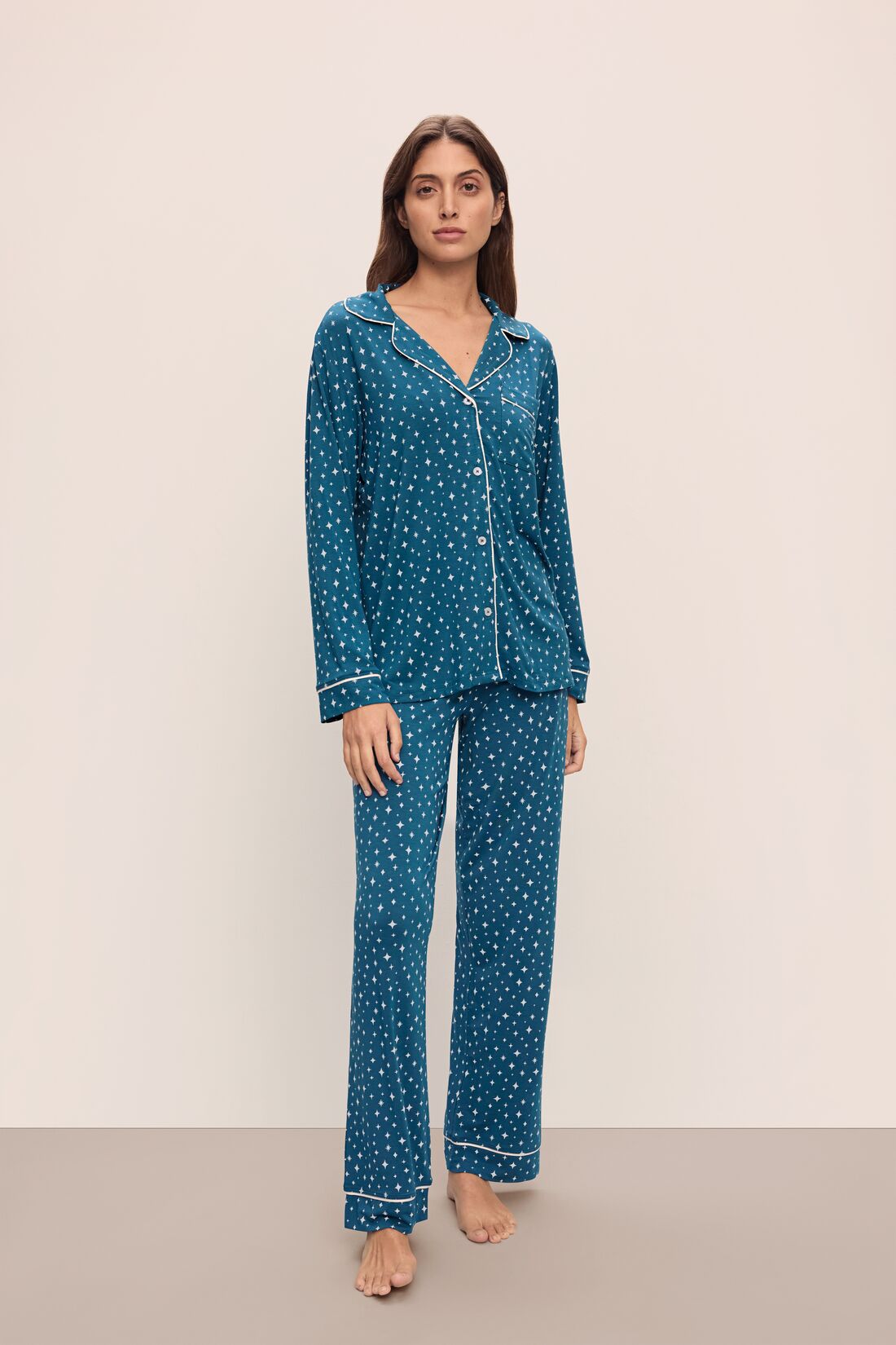 Model wears the Gisele Printed TENCEL™ Modal Long PJ Set in Festive Lights Sapphire/Ivory.