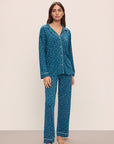 Model wears the Gisele Printed TENCEL™ Modal Long PJ Set in Festive Lights Sapphire/Ivory.