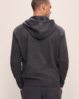 Model is wearing Men's Recycled Boucle Hoodie in Graphite.