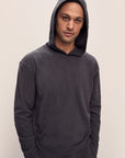 Model is wearing Men's Recycled Boucle Hoodie in Graphite.