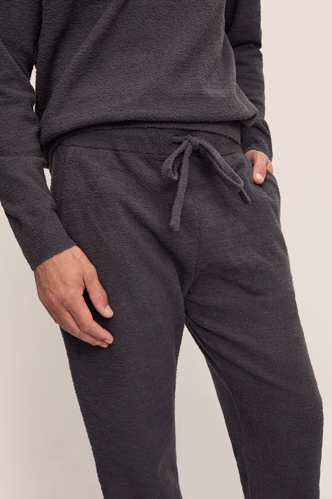 Model wears Men's Recycled Boucle Jogger in Graphite.