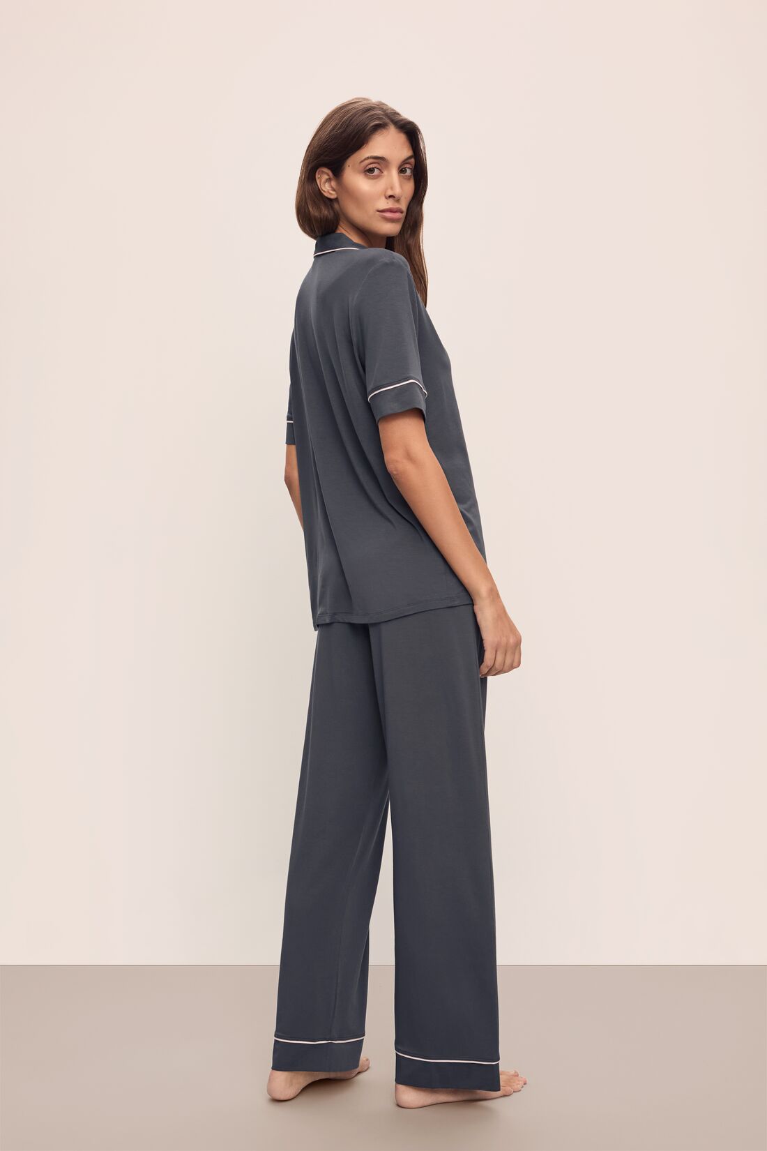 Model wears Gisele TENCEL™ Modal Short Sleeve & Pant PJ Set in Graphite/Sorbet Pink.