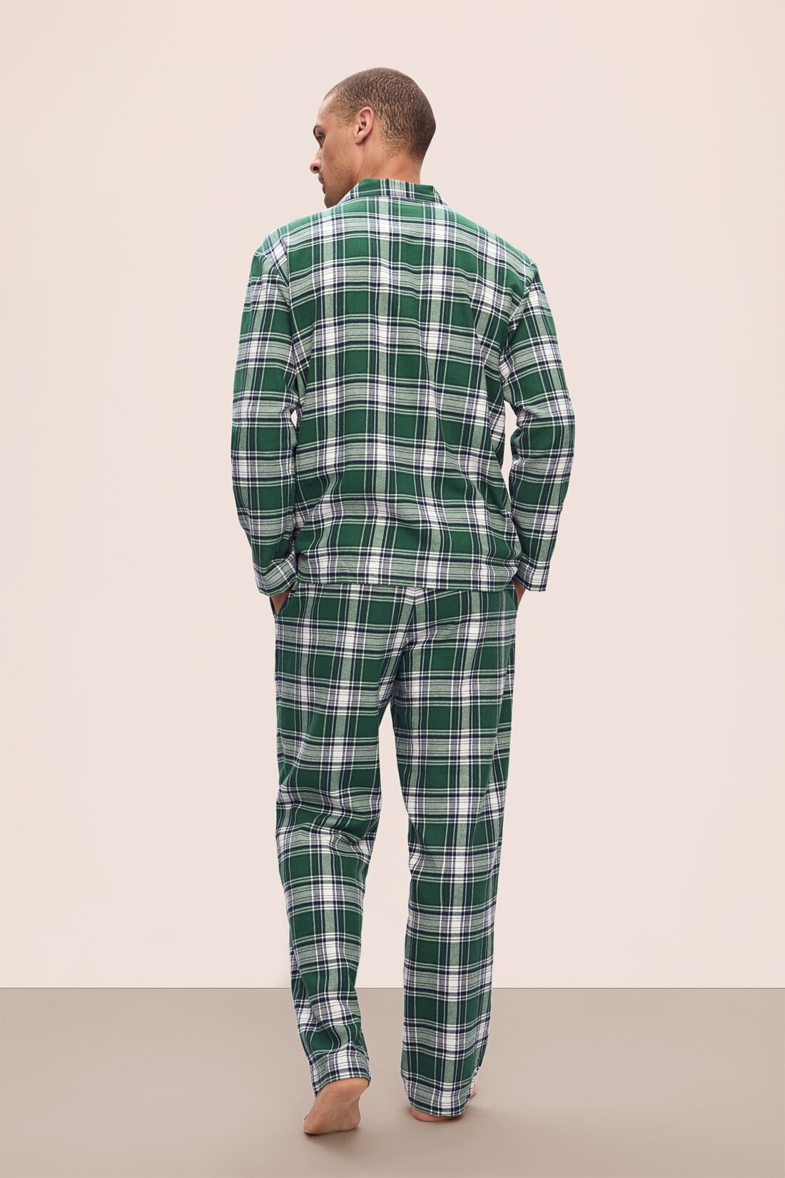 Model wears Men&#39;s Flannel Long PJ Set in Tartan Plaid Forest Green.