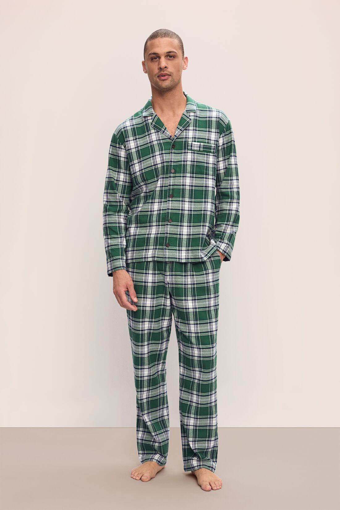 Model wears Men's Flannel Long PJ Set in Tartan Plaid Forest Green.