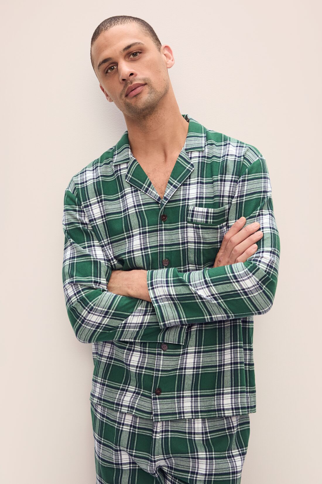 Model wears Men&#39;s Flannel Long PJ Set in Tartan Plaid Forest Green.