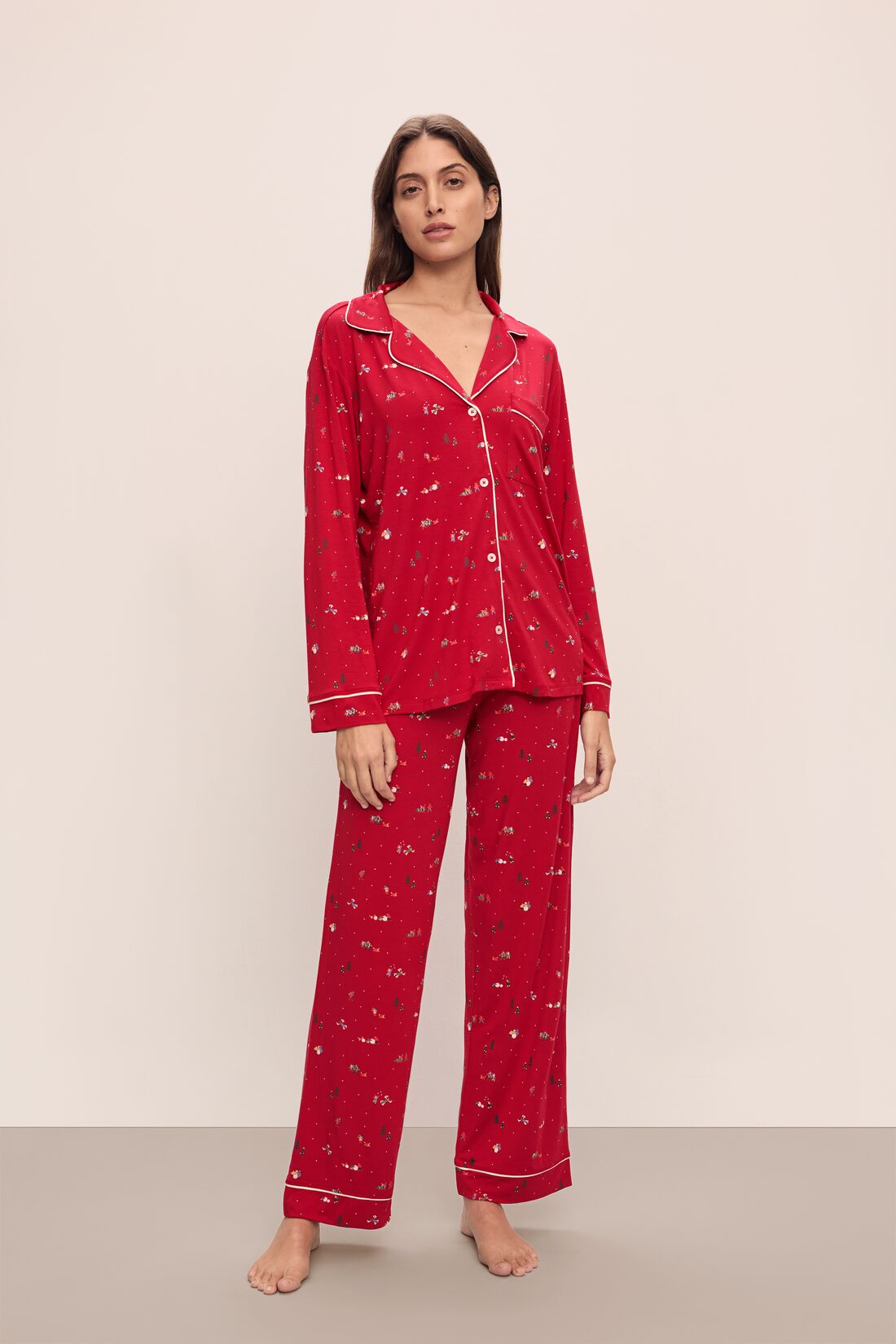 Model wears the Gisele Printed TENCEL™ Modal Long PJ Set in Winter Wonderland Haute Red/Ivory.