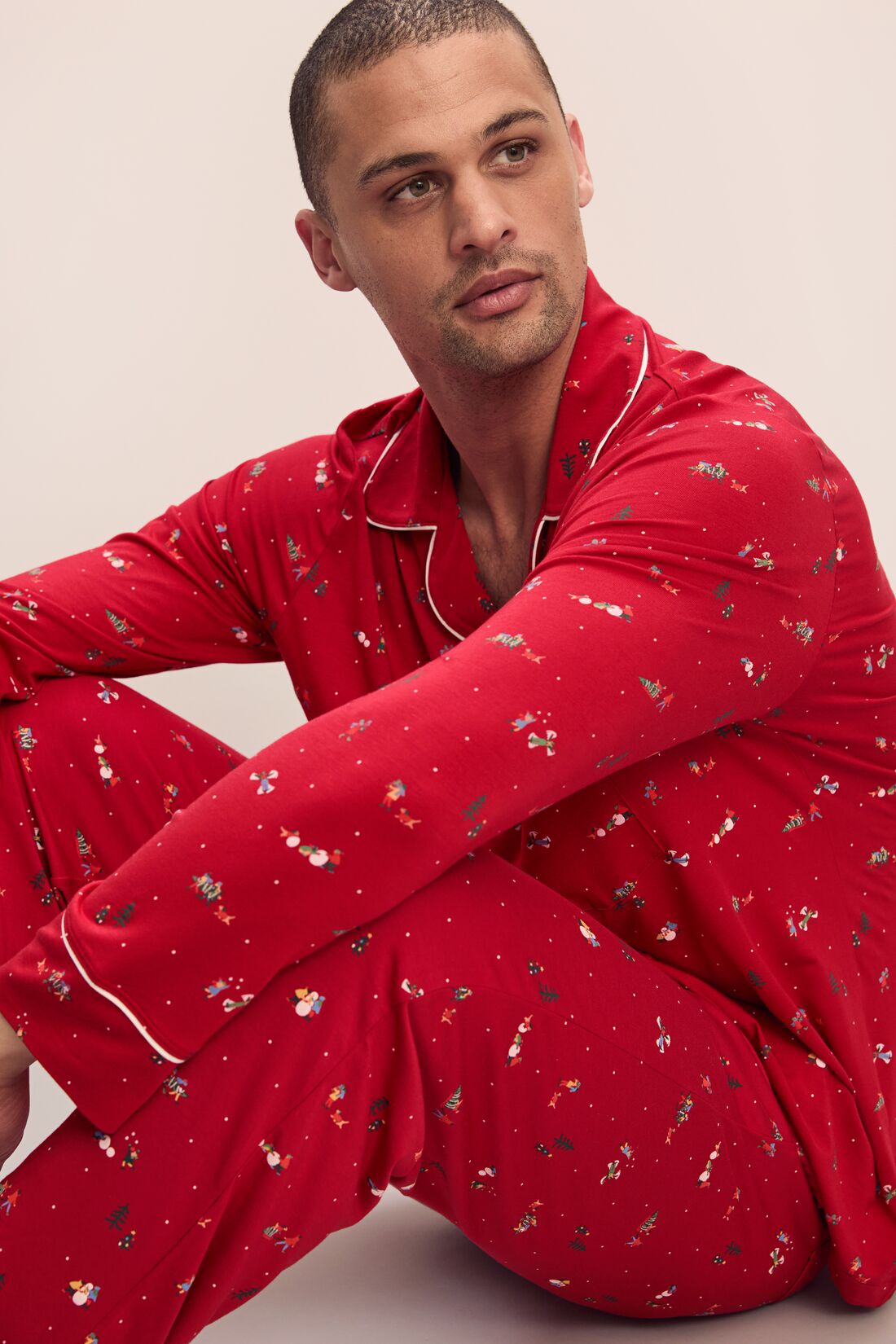 Model wears William Printed TENCEL™ Modal Long PJ Set in Winter Wonderland Haute Red/Ivory.