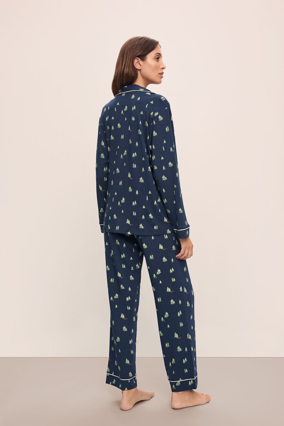 Model wears the Gisele Printed TENCEL™ Modal Long PJ Set in Woodland Pine Navy/Ivory.