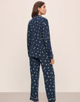 Model wears the Gisele Printed TENCEL™ Modal Long PJ Set in Woodland Pine Navy/Ivory.