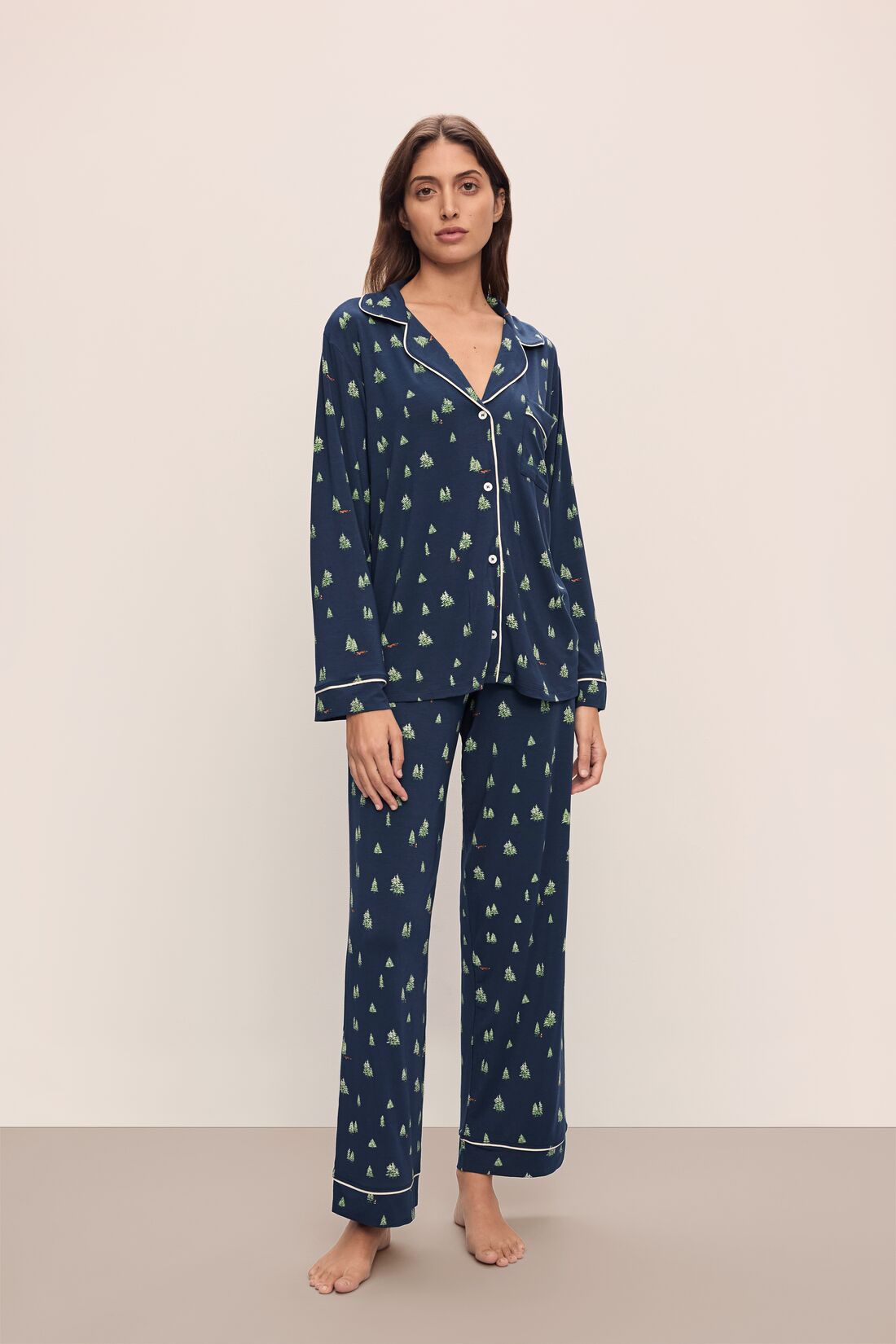 Model wears the Gisele Printed TENCEL™ Modal Long PJ Set in Woodland Pine Navy/Ivory.