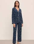 Model wears the Gisele Printed TENCEL™ Modal Long PJ Set in Woodland Pine Navy/Ivory.