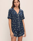 Model wears Gisele Printed TENCEL™ Modal Relaxed Short PJ Set in Woodland Pine Navy/Ivory.