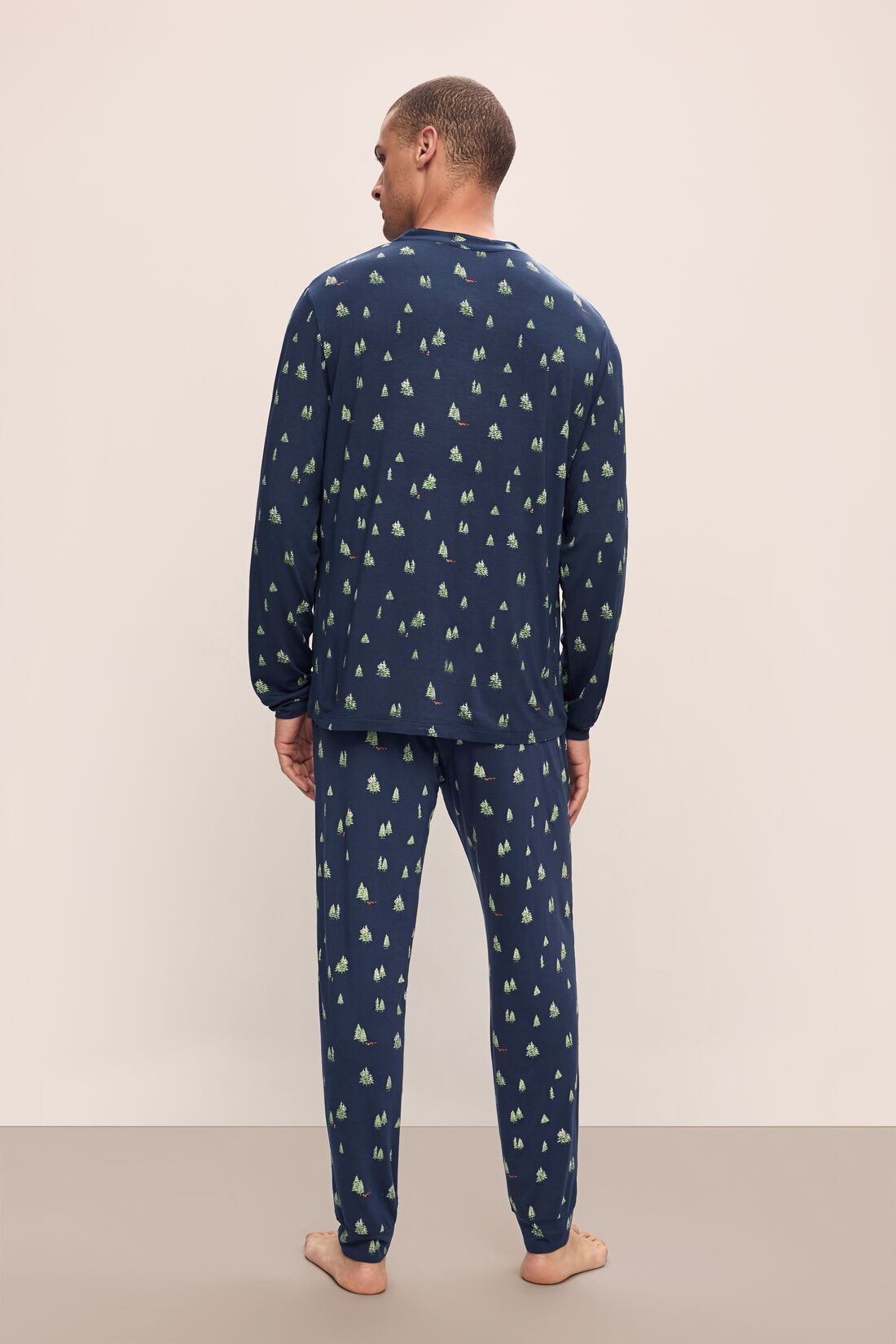 Model wears Henry Printed TENCEL™ Modal Long PJ Set in Woodland Pine Navy/Ivory.