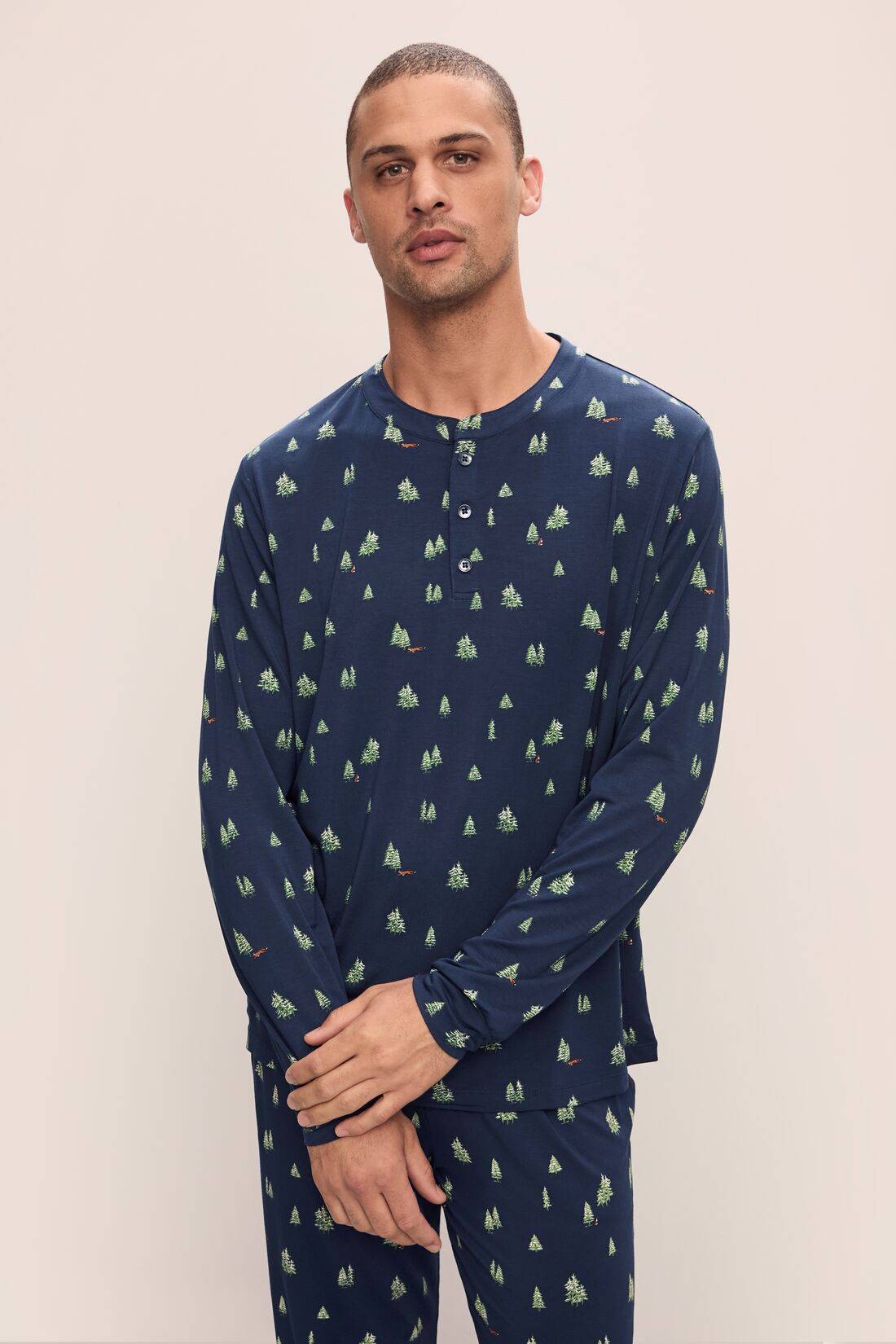 Model wears Henry Printed TENCEL™ Modal Long PJ Set in Woodland Pine Navy/Ivory.