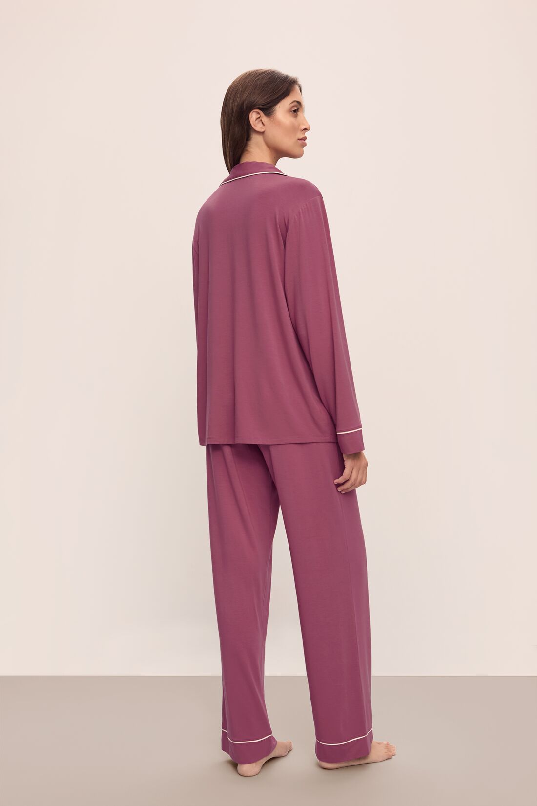 Model wears Gisele TENCEL™ Modal Long PJ Set in Raspberry/Ivory.