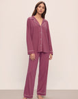 Model wears Gisele TENCEL™ Modal Long PJ Set in Raspberry/Ivory.