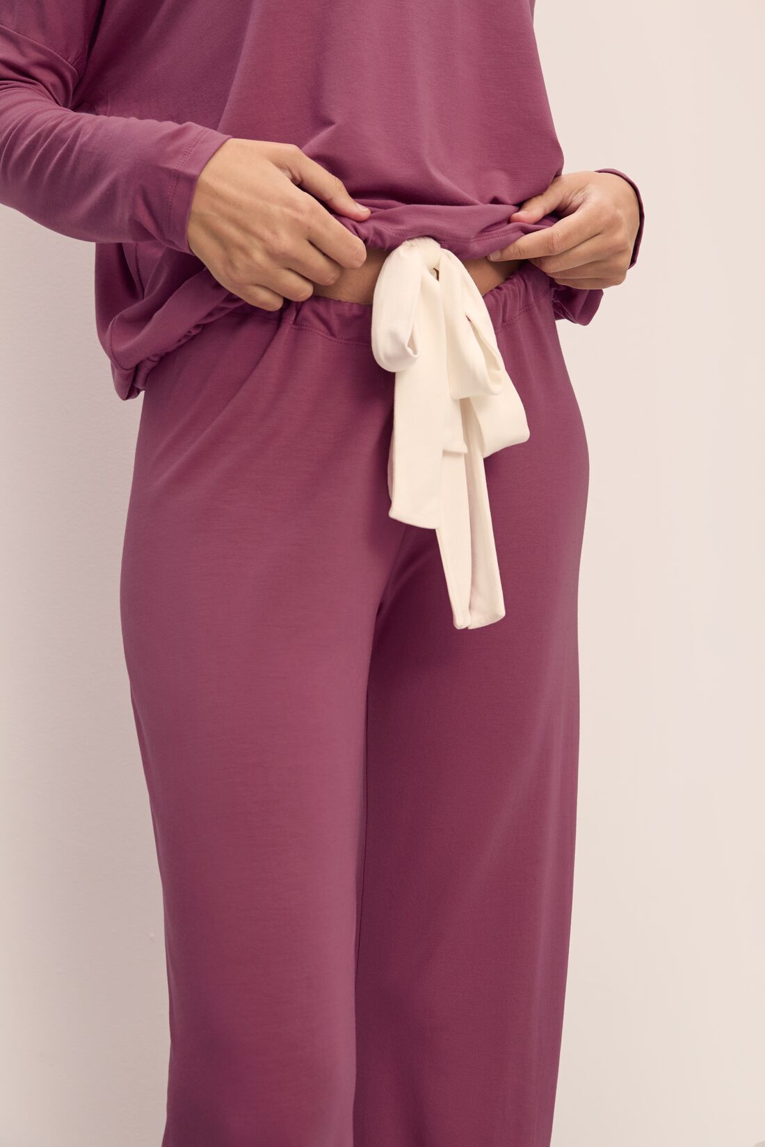 Model wears Gisele TENCEL™ Modal Slouchy PJ Set in Raspberry/Ivory.