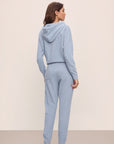 Model in Recycled Boucle Women's Hoodie and Jogger in Wedgewood.