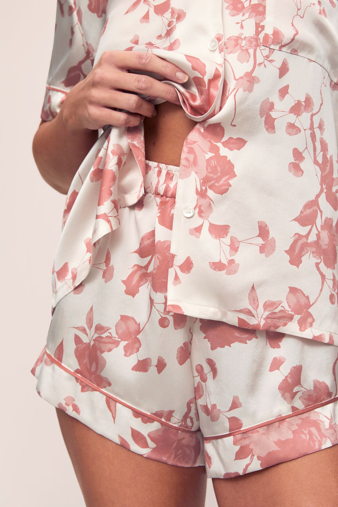 Model is wearing Inez Washable Silk Printed Short PJ Set in Ikebana Pearl/Dusty Rose.