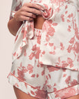 Model is wearing Inez Washable Silk Printed Short PJ Set in Ikebana Pearl/Dusty Rose.