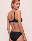 Model is wearing Soft Stretch Recycled Lace High Leg Brief in Black