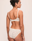 Model is wearing Soft Stretch Recycled Lace High Leg Brief in Ivory