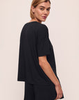 Model wears Gisele TENCEL™ Modal Everyday T-Shirt in black.