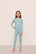 Model is wearing Kids Tencel™ Modal Unisex Long Pj Set in Canal Blue/Ivory