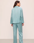 Model is wearing Inez Washable Silk Long Pj Set in Canal Blue/Ivory