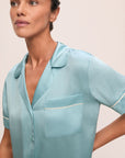 Model is wearing Inez Washable Silk Short Pj Set in Canal Blue/Ivory