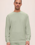 Model is wearing Mens French Terry Sweatshirt in Matcha