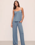 Model is wearing Gisele TENCEL™ Modal Cami & Pant PJ Set in Faded Denim