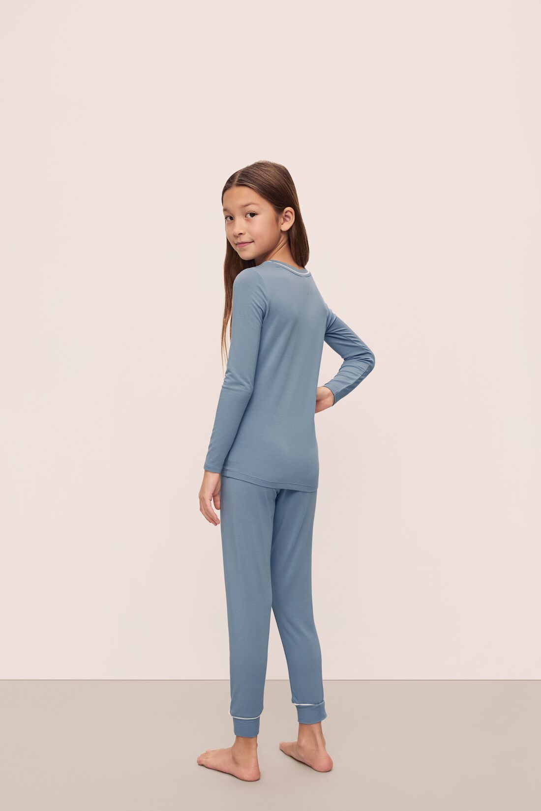 Model is wearing Kids TENCEL™ Modal Unisex Long PJ Set in Faded Denim/Ivory