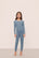 Model is wearing Kids TENCEL™ Modal Unisex Long PJ Set in Faded Denim/Ivory