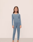 Model is wearing Kids TENCEL™ Modal Unisex Long PJ Set in Faded Denim/Ivory