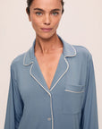 Model is wearing Gisele TENCEL™ Modal Long PJ Set in Faded Denim/Ivory