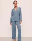 Model is wearing Gisele TENCEL™ Modal Long PJ Set in Faded Denim/Ivory